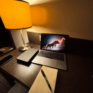 Workspace with laptop showing amazon affiliate marketing notes