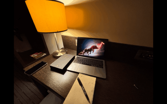 Workspace with laptop showing amazon affiliate marketing notes