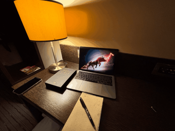 Workspace with laptop showing amazon affiliate marketing notes