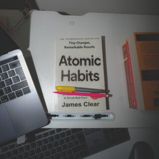 image of Atomic Habits book with stationery items