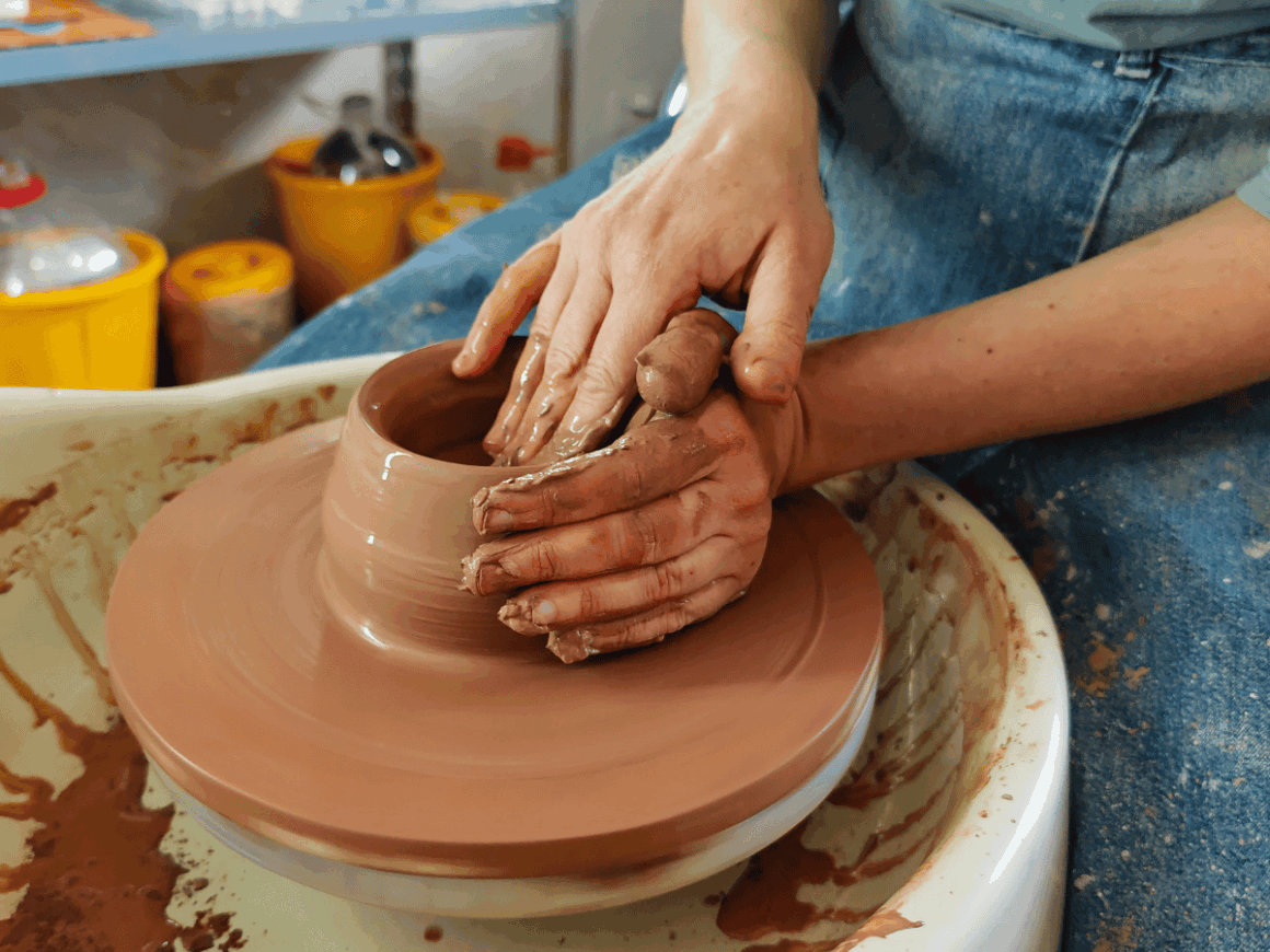 Pottery making on a clay wheel as a relaxing creative hobby